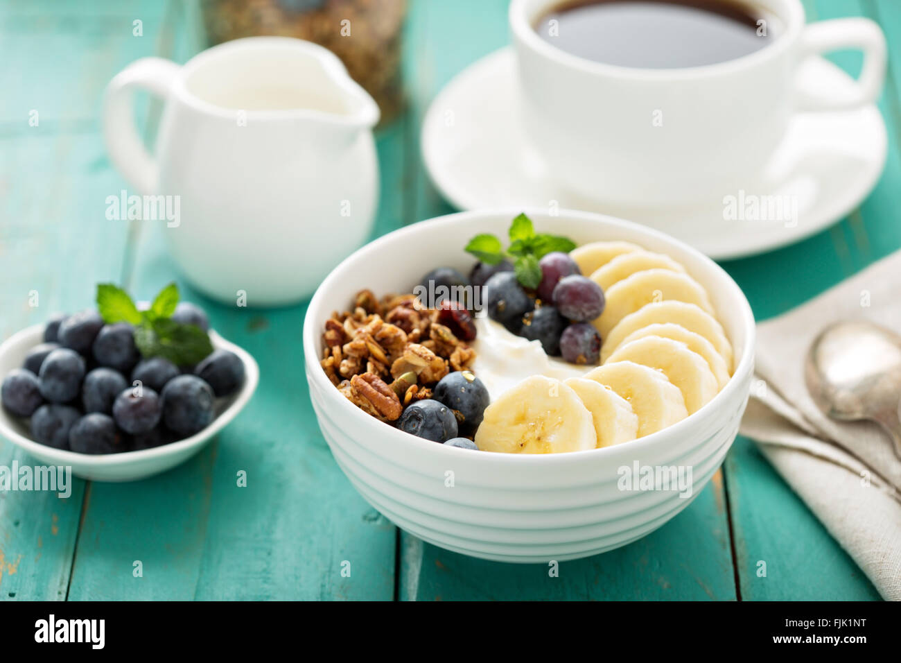 Granola bowl with yogurt and banana Stock Photo