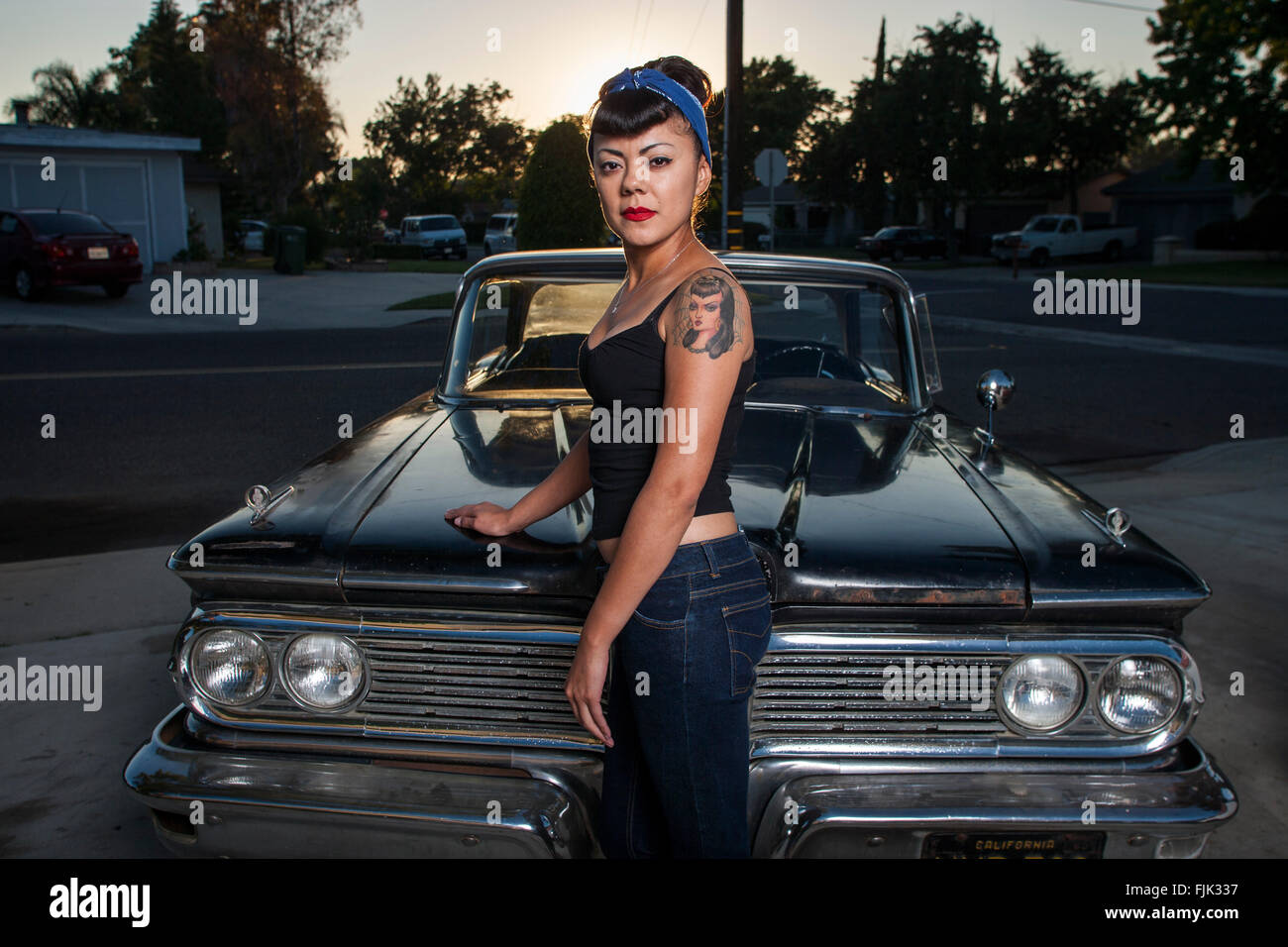 LOS ANGELES, CA – JUNE 29: Latina’s of the L.A. based car club 'The Black Widows' in Los Angeles, California on June 29, 2005. Stock Photo