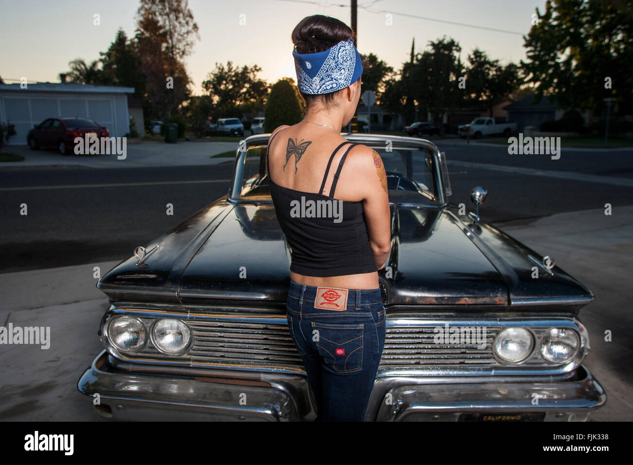 LOS ANGELES, CA – JUNE 29: Latina’s of the L.A. based car club 'The Black Widows' in Los Angeles, California on June 29, 2005. Stock Photo