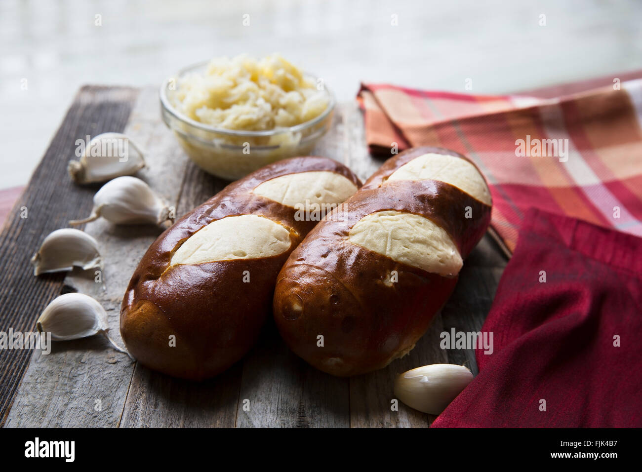 Bread made in German soft pretzel style with sauerkraut and garlic. Stock Photo