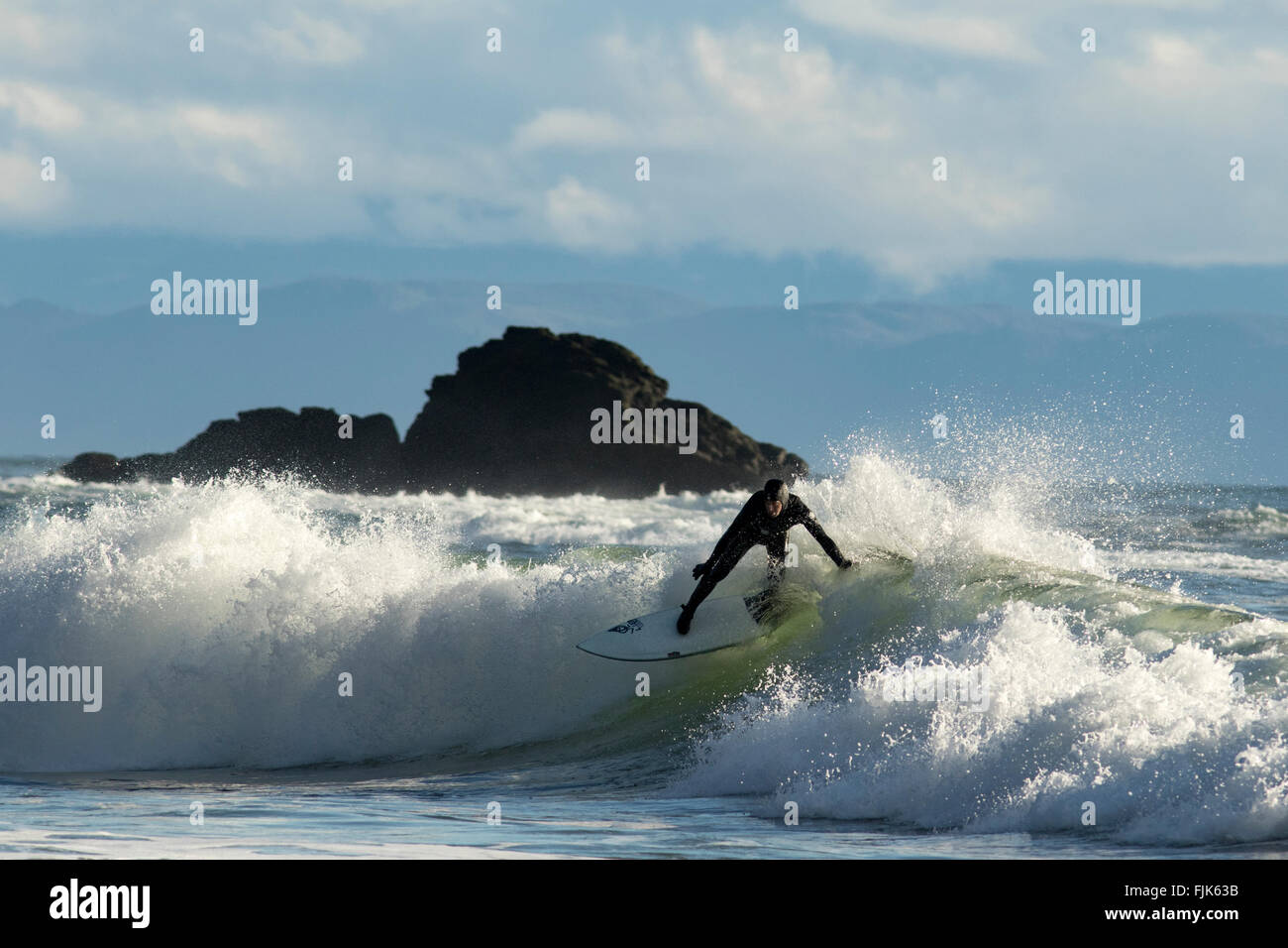 Surfer at Sombrio Beach - Juan de Fuca Provincial Park, Vancouver Island, British Columbia, Canada Stock Photo