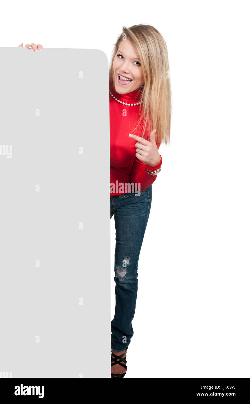 Woman standing behind a display board or wall Stock Photo