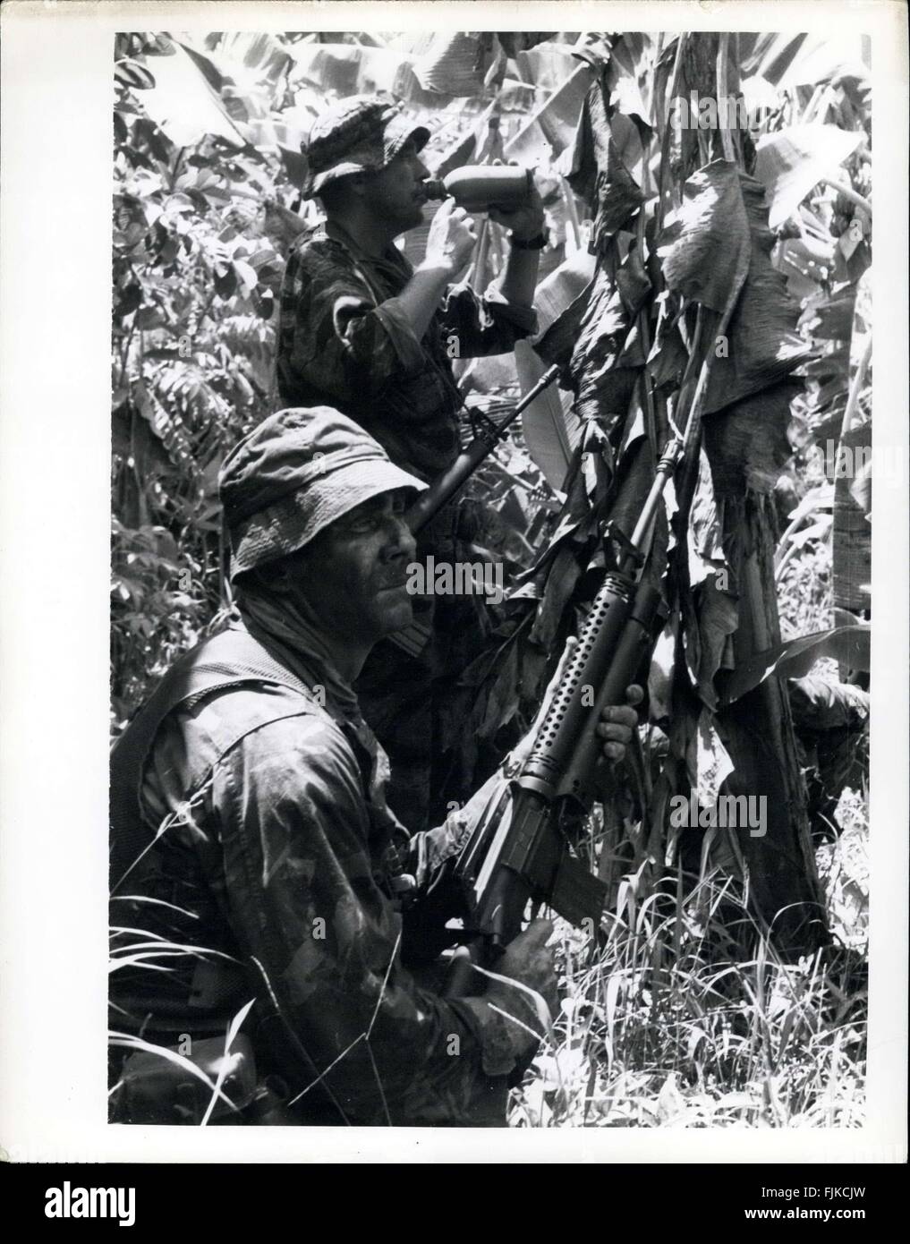 1966 - Phi Dan Dodd; Republic of Vietnam Two US Navy Seals (Sea, Air and Land) pause briefly for a drink of water during operation Crimson Tide, a pre-planned operation in Vinh Binh province 67 miles South West of Saigon. Seals are counter guerilla experts, highly trained in unconventional warfare and Para military operations. This operation resulted in five enemy guerillas killed, and 153 camouflaged structures and fortifications 120 Sampans and 75 destroyed. (Credit Image: © Keystone Pictures USA/ZUMAPRESS.com) Stock Photo