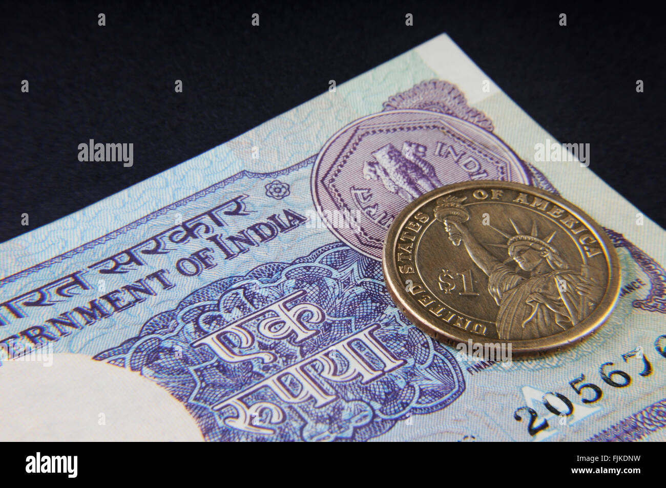 Indian Rupee note and American Dollar Stock Photo