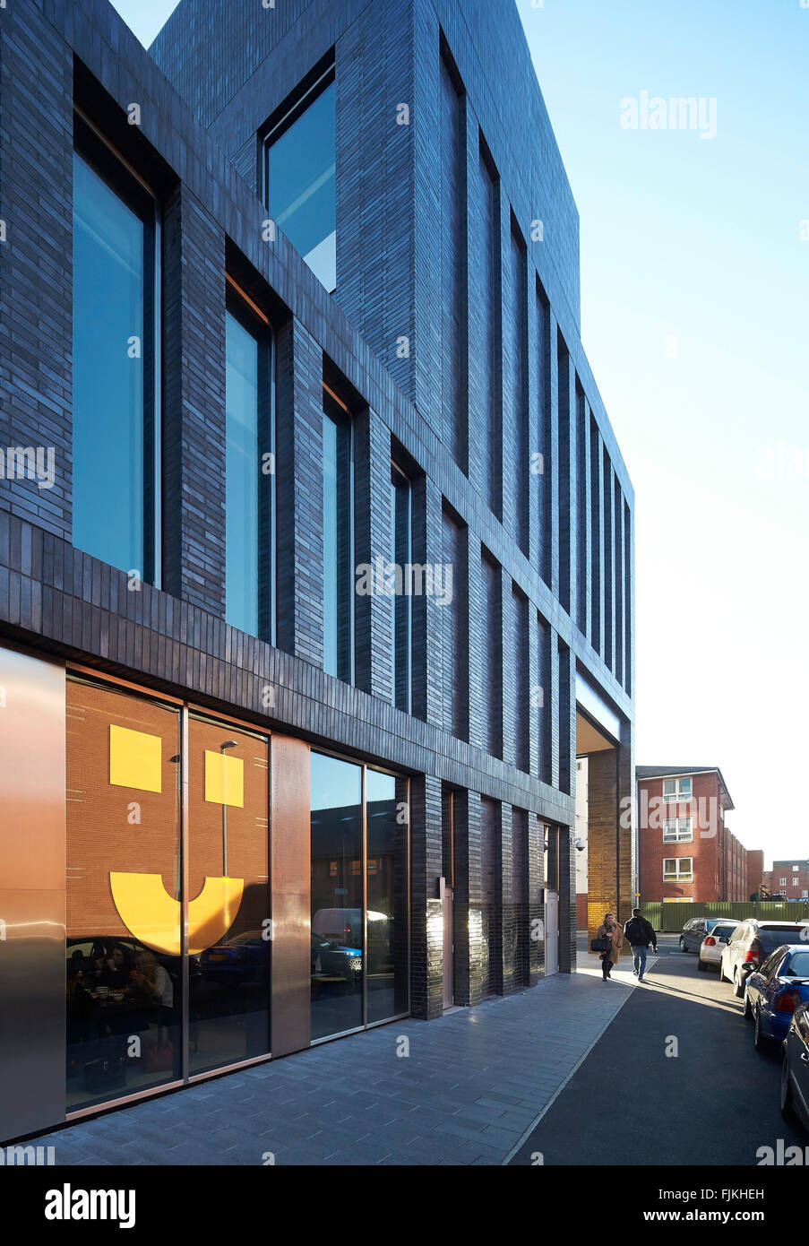 Street facade perspective. MMU Student Union, Manchester, United Kingdom. Architect: Feilden Clegg Bradley Studios LLP, 2015. Stock Photo