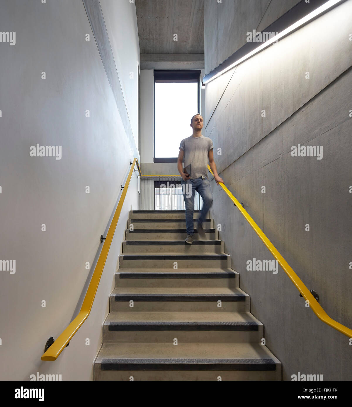 Stairwell with concrete walls. MMU Student Union, Manchester, United Kingdom. Architect: Feilden Clegg Bradley Studios LLP, 2015 Stock Photo