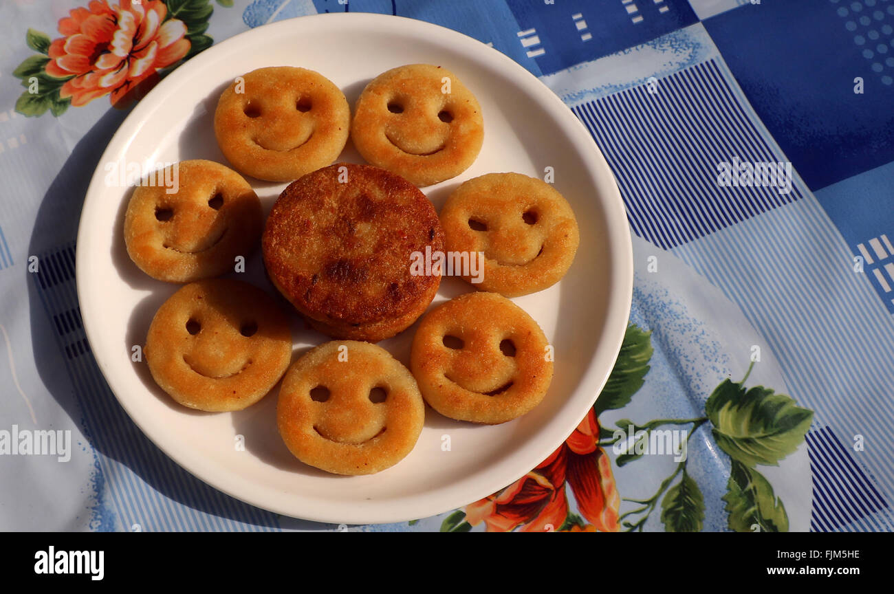 Snack made with potato - fried potato as smile shape ; a popular Indian
