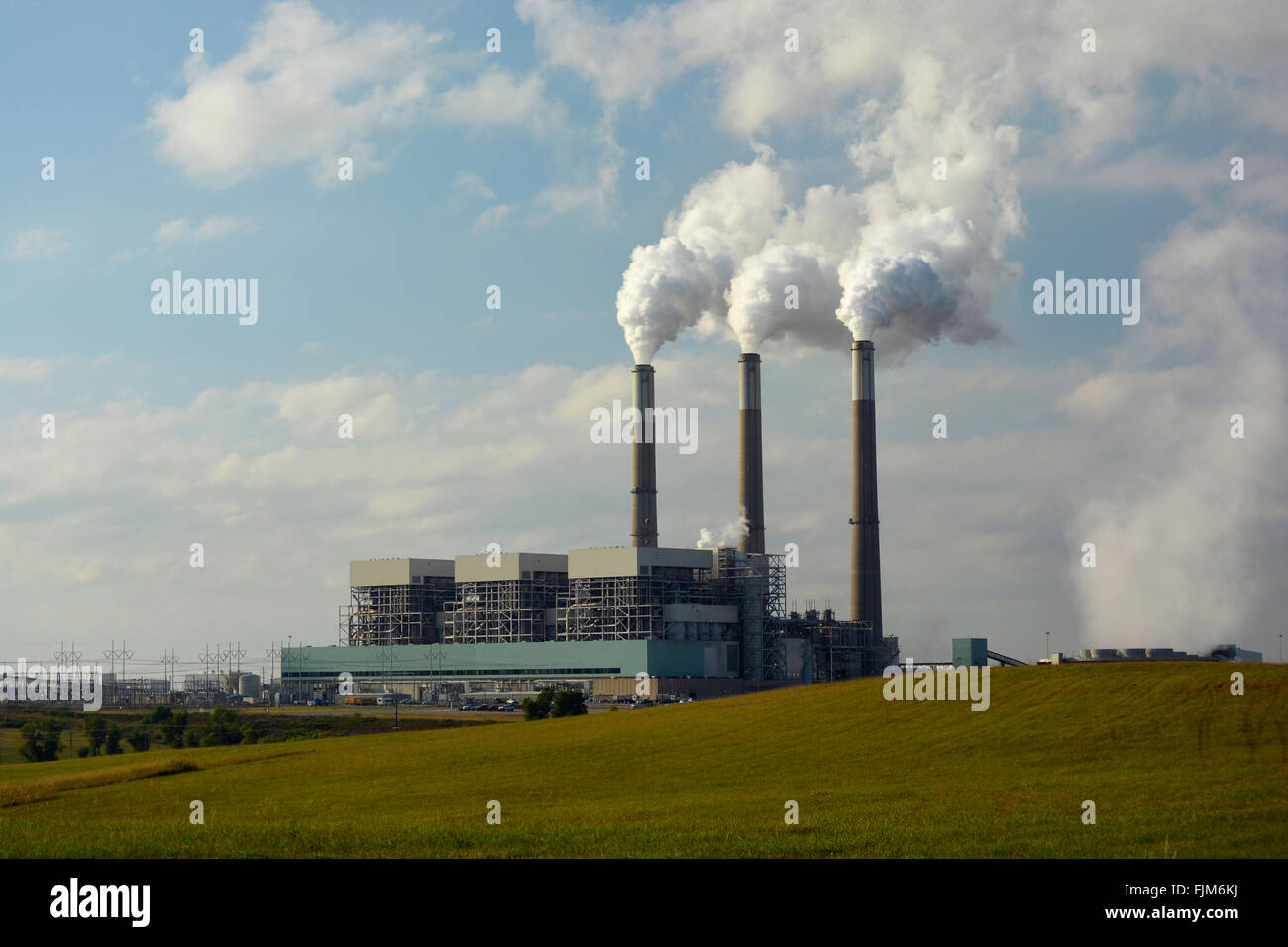 Coal Power Plant with Carbon Dioxide Coming from Smokestacks. Stock Photo