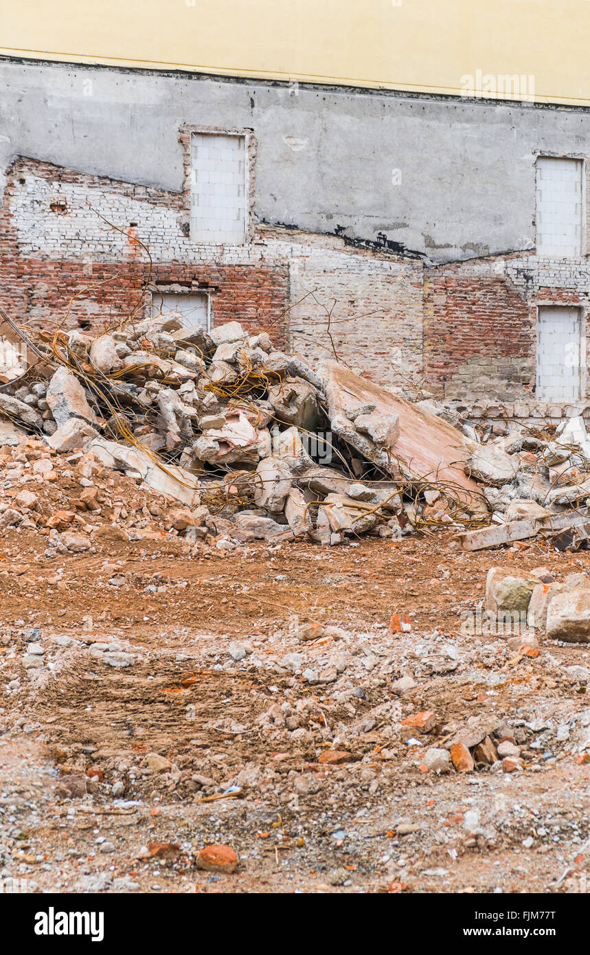 knocked down buildings with outlines of buildings conserved on a remaining wall Stock Photo