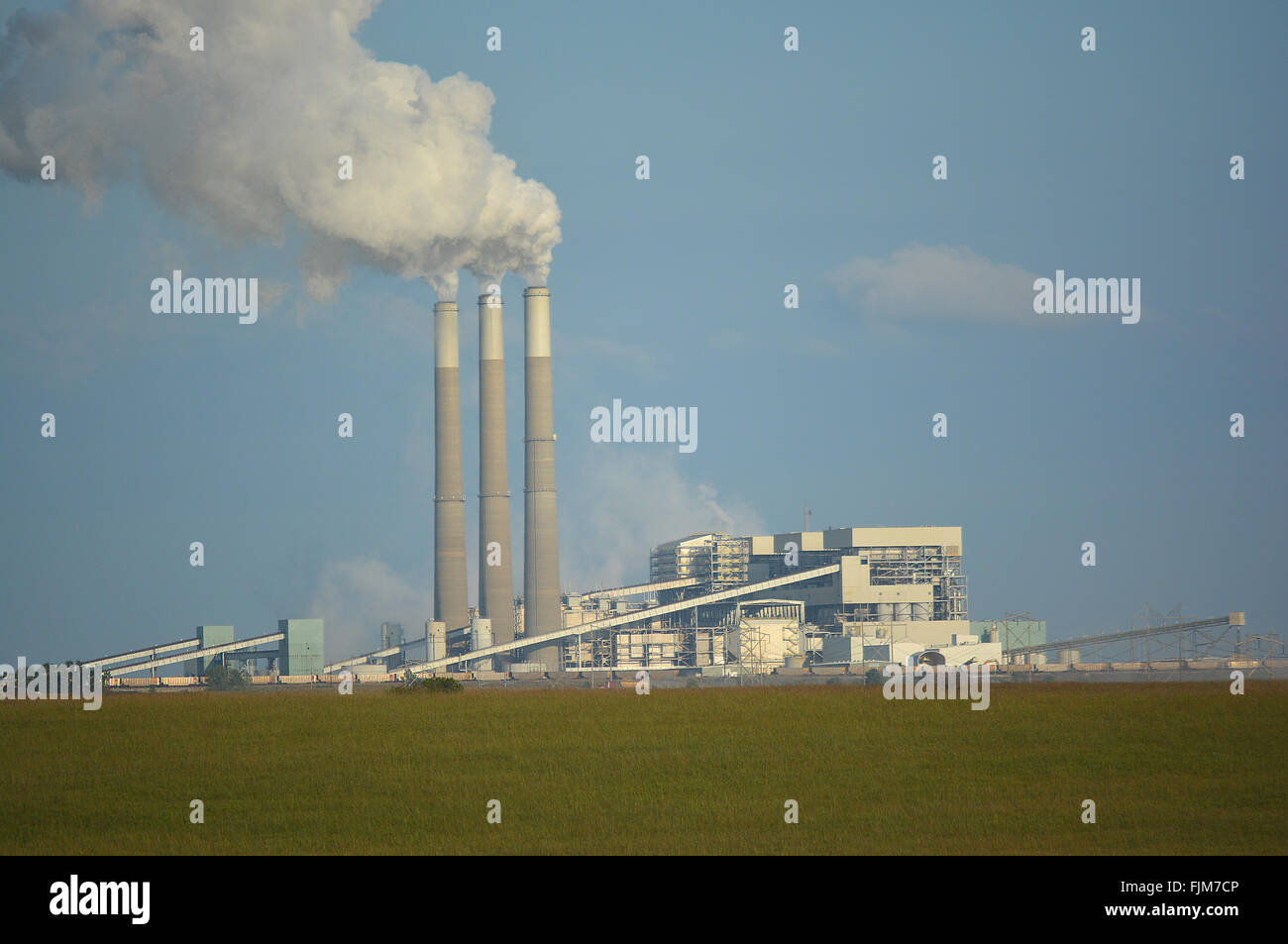 Coal Power Plant Emits Carbon Dioxide from Smoke Stacks Stock Photo