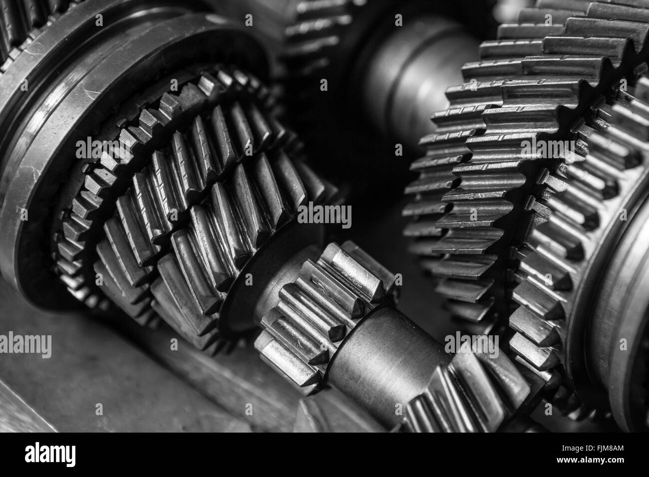 Monochrome image of  car gear cogs in a garage Stock Photo