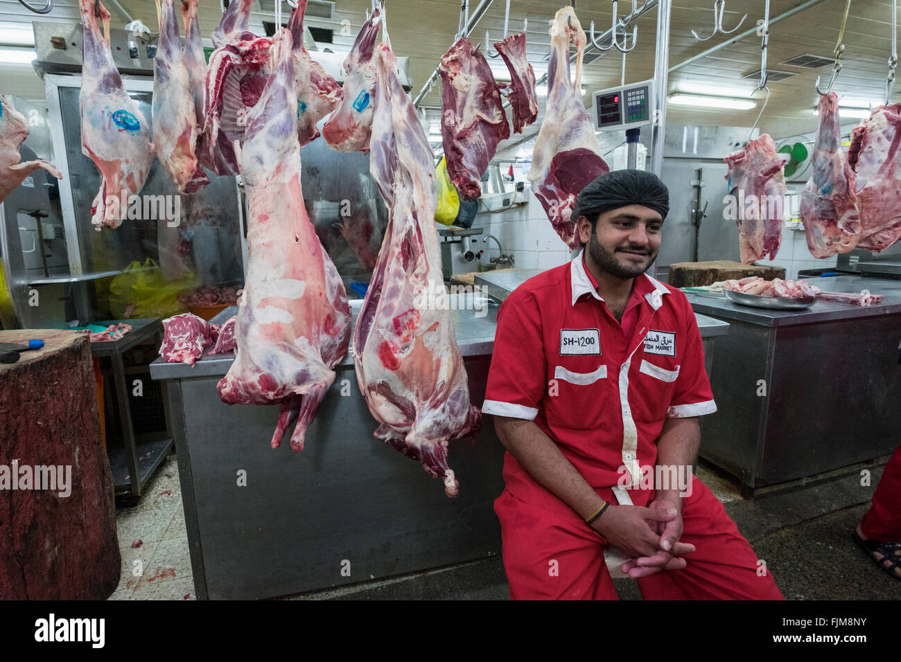 Butcher working in Dubai meat market in Deira United Arab Emirates Stock Photo
