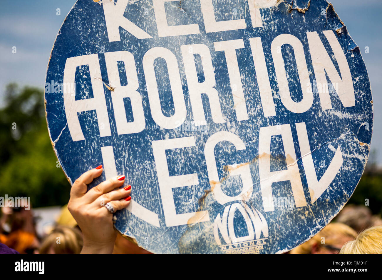A women holds up a Keep Abortion Legal sign. Outside the capital building in Austin, Texas Stock Photo