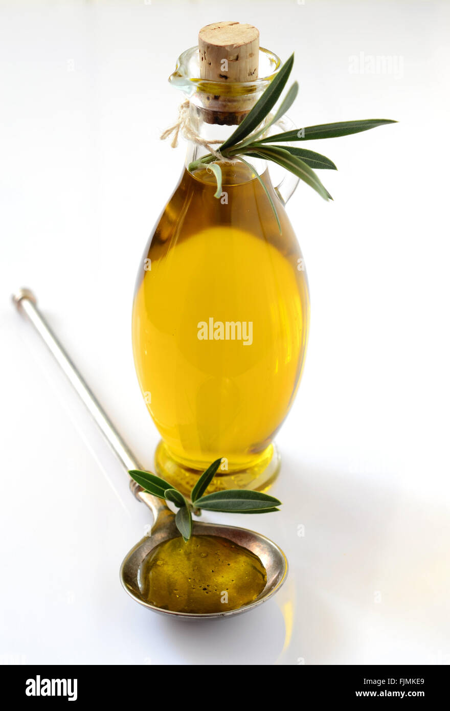 Extra virgin Olive oil in a glass bottle Stock Photo - Alamy