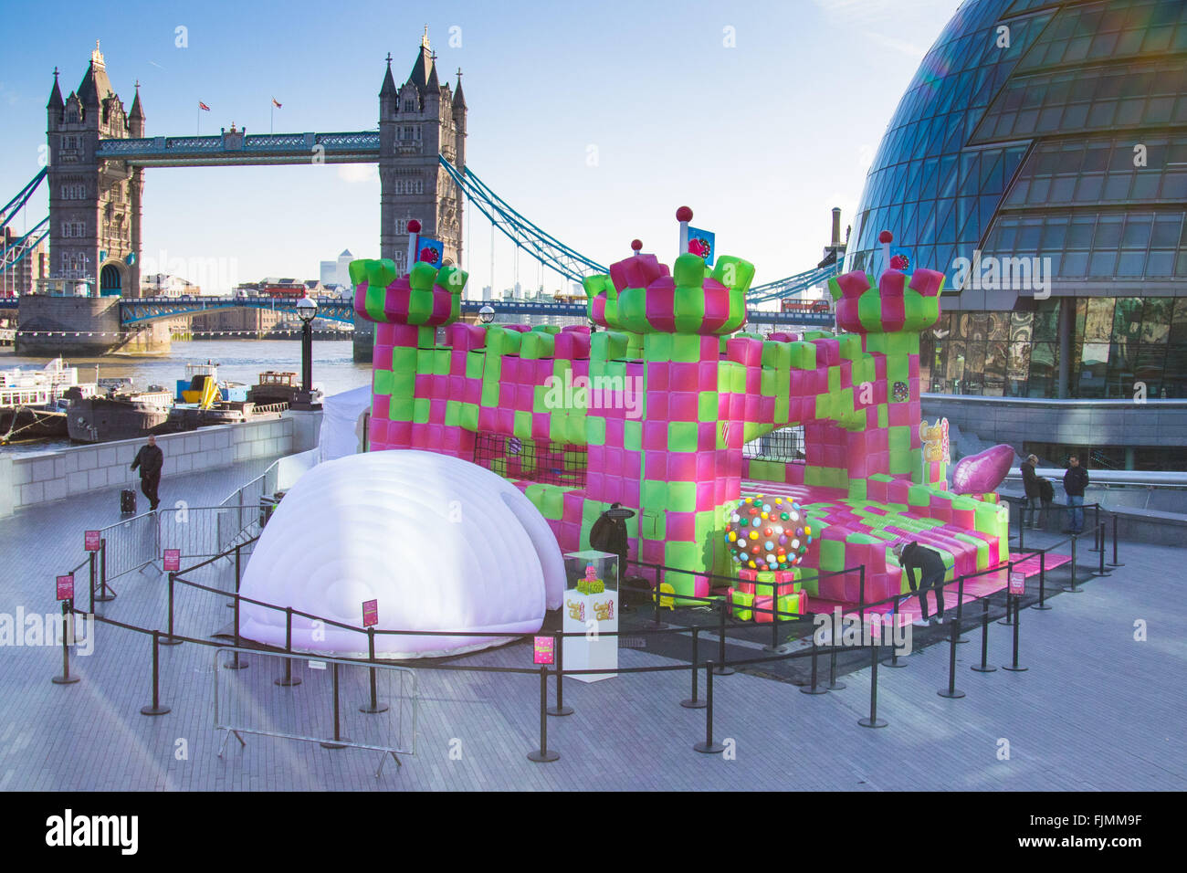 More London Place, London, UK. March 3rd 2016. A jelly-themed, adults-only bouncy castle which has been created to celebrate the launch of Candy Crush Jelly Saga, opens on London’s Southbank. The multi-sensory bouncy castle especially designed for grown-ups,  marks the latest instalment of the new mobile game, Candy Crush Jelly Saga. The bouncy castle brings to life elements of the jelly-themed game and will be open to the public for free. Credit:  Paul Davey/Alamy Live News Stock Photo