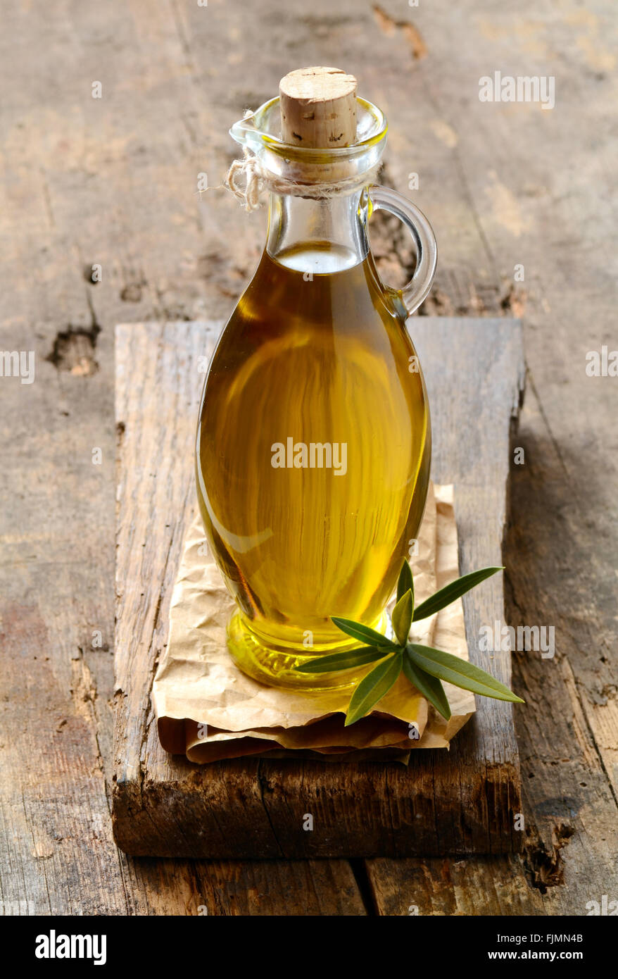 Extra virgin Olive oil in a glass bottle Stock Photo - Alamy