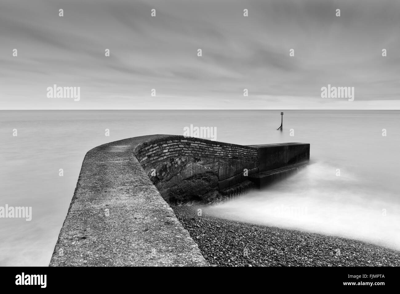 Stone pier Devon seaside Stock Photo