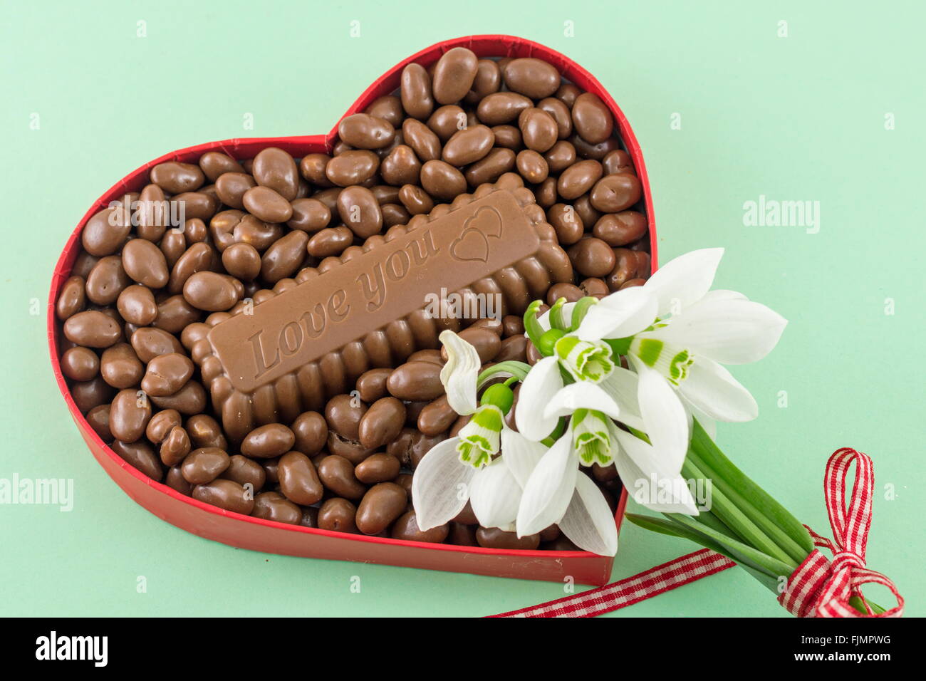 heart shaped box filled with chocolate with an I love you sign Stock Photo