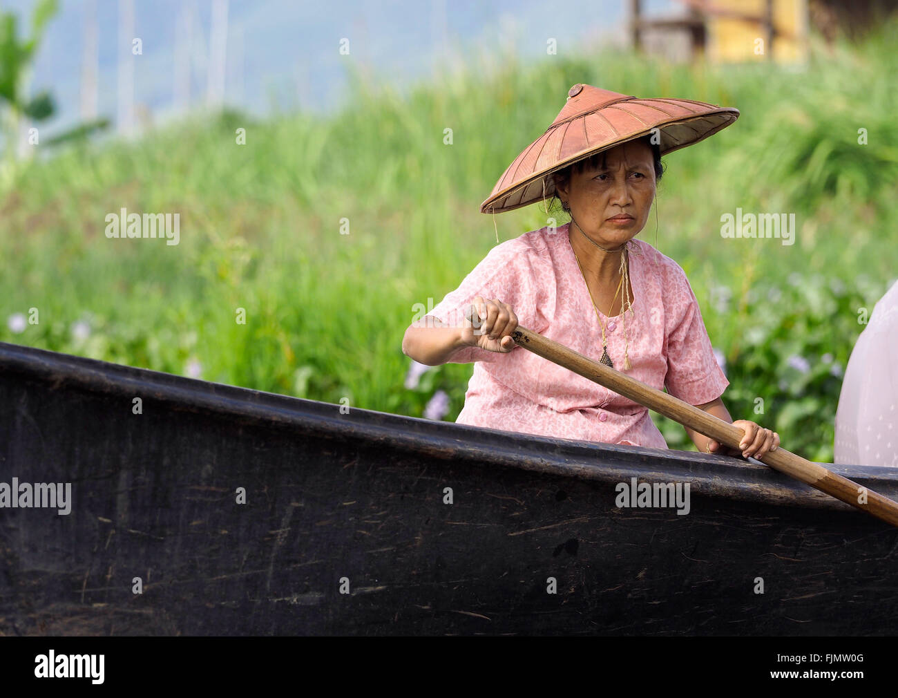 Woman in a wooden canoe, 'Inle Lake', Myanmar, Asia Stock Photo
