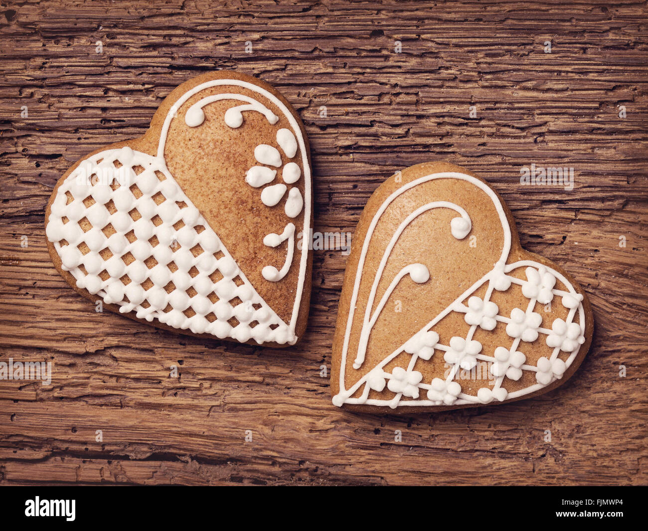 Gingerbread heart cookies on a wooden brown background Stock Photo - Alamy