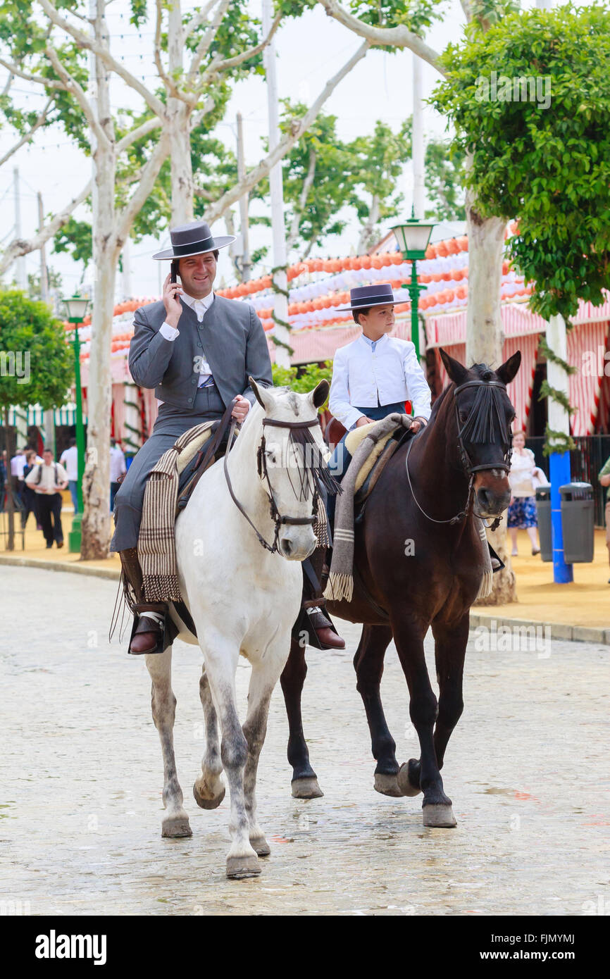 Seville, Spain April 29, 2015 Horse riders taking a walk by the fair