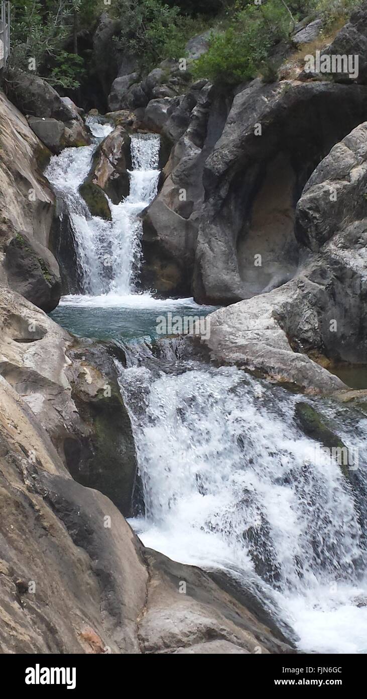 Waterfall Among Rocks Stock Photo - Alamy