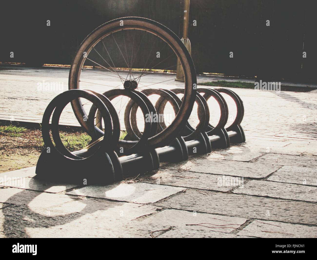 Wheel bicycle rack footpath bicycle rack hires stock photography and