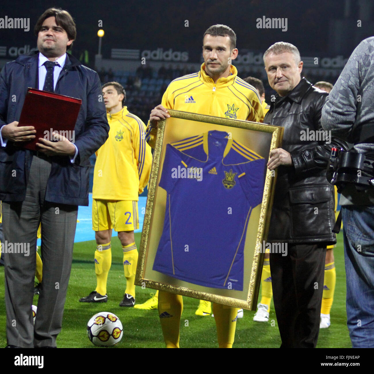 KYIV, UKRAINE - OCTOBER 8, 2010: Andriy Shevchenko of Ukraine (C) awarding for making his 100th appearance with Ukraine’s national team before friendly game against Canada on October 8, 2010 in Kyiv, Ukraine Stock Photo