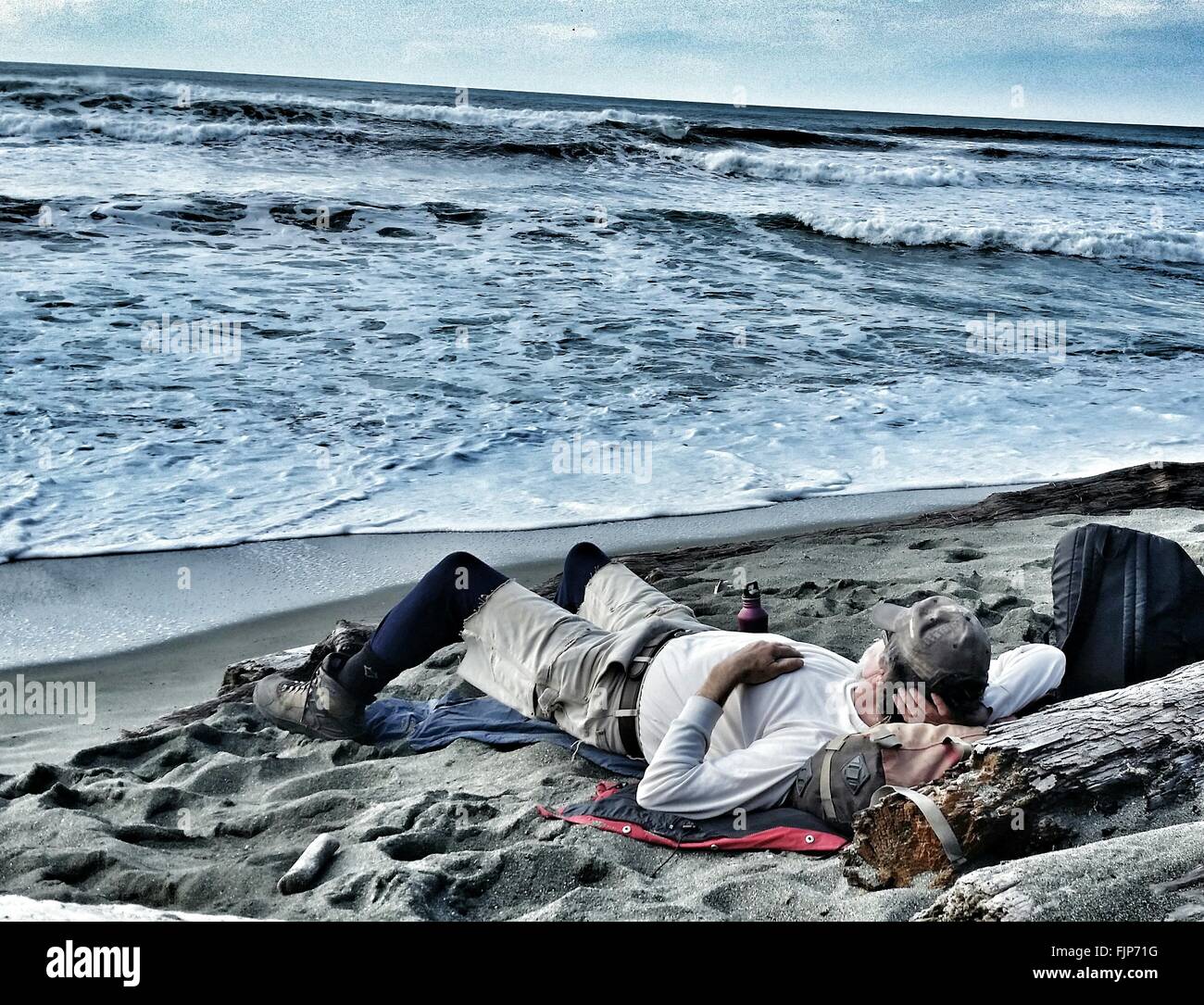 Man Sleeping On Beach High Resolution Stock Photography and Images Alamy