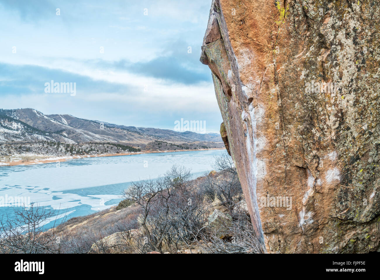 climbing wall with white chalk marks over Horsetooth Reservoir, Rotary  Park, Fort Collins, Colorado, winter scenery with ice on Stock Photo - Alamy