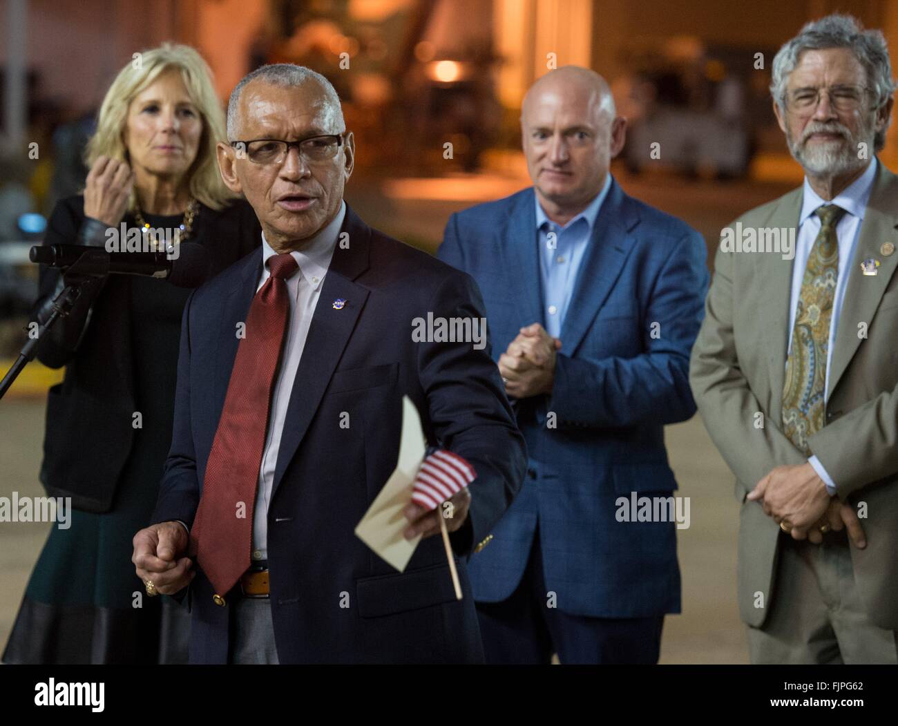 Houston, USA. 03rd Mar, 2016. NASA Administrator Charles Bolden welcomes astronaut and Expedition 46 Commander Scott Kelly of NASA on arrival at Ellington Field March 3, 2016 in Houston, Texas. Standing behind Boden are: (L-R) Dr. Jill Biden, wife of Vice President Joe Biden Mark Kelly, former NASA astronaut and Scott Kelly's identical twin, Dr. John Holdren, director of the White House Office of Science. Stock Photo