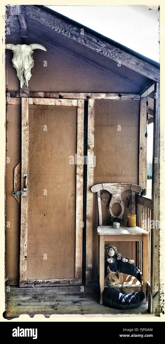 Dog under chair hires stock photography and images Alamy