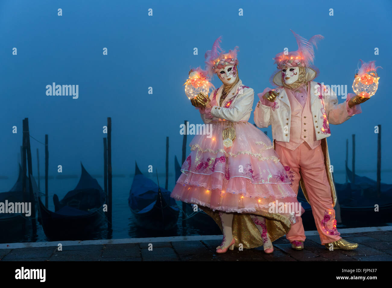 A couple dressed up for carnival, Venice, Veneto, Italy Stock Photo