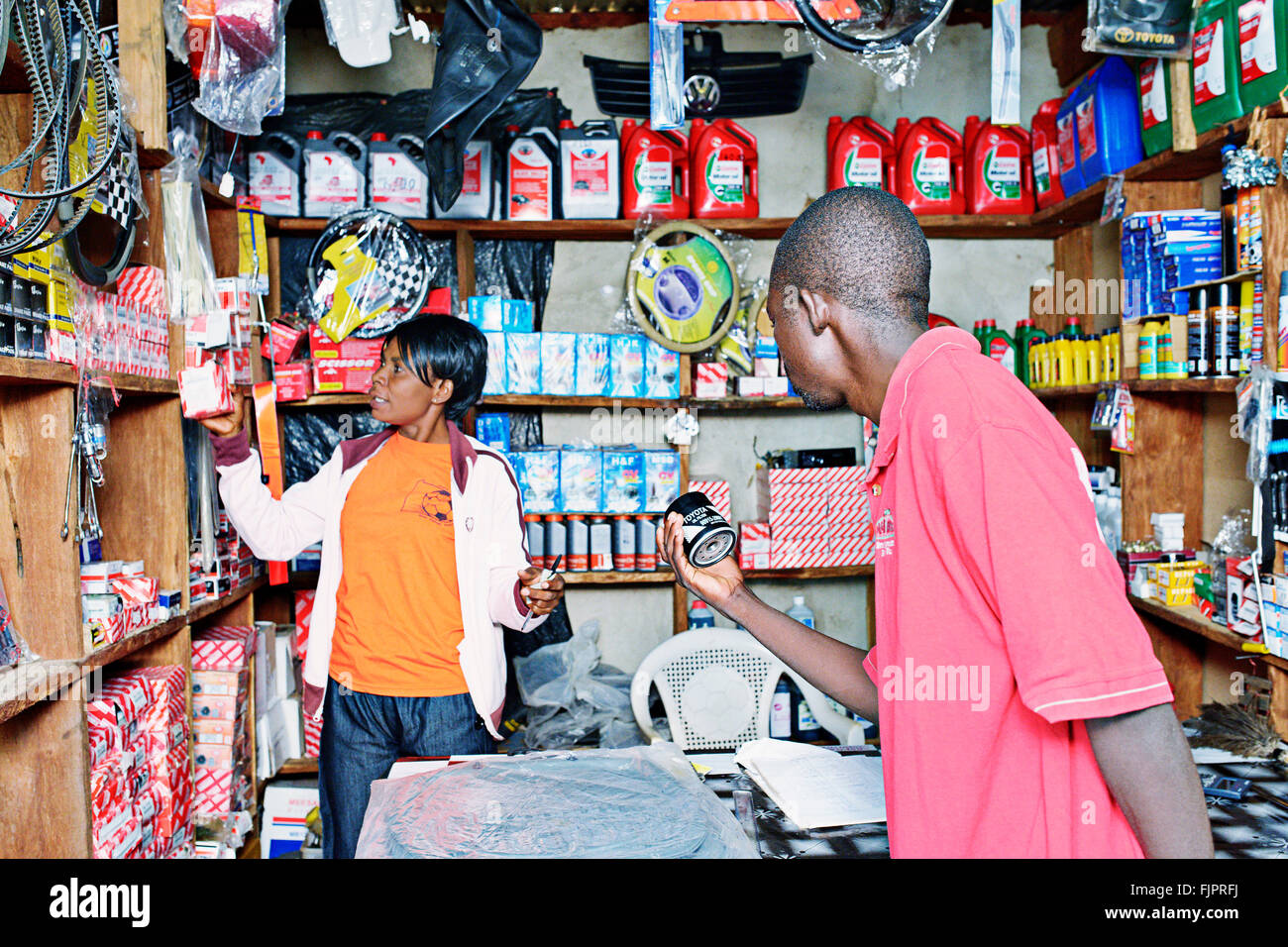 Man buing car parts in small shop Manyama, Zambia. Stock Photo