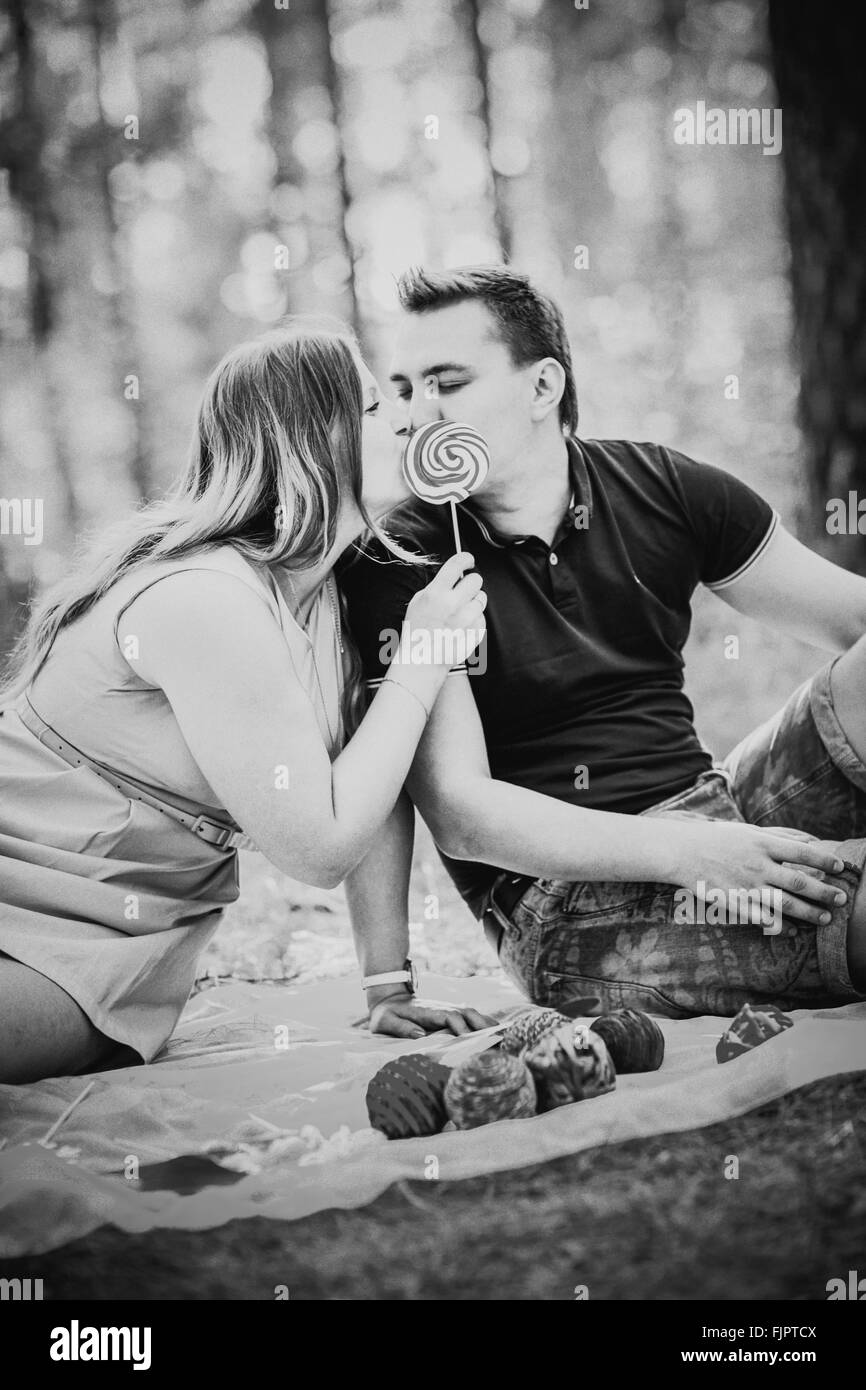 Black white photography romantic young couple kissing on background ...