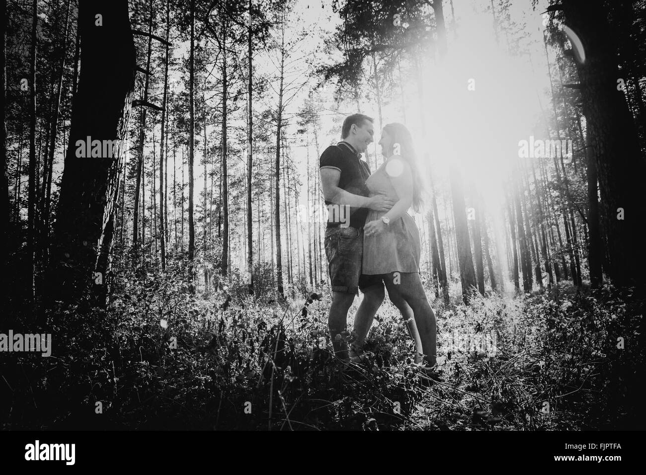 Black white photography romantic young couple kissing on background ...