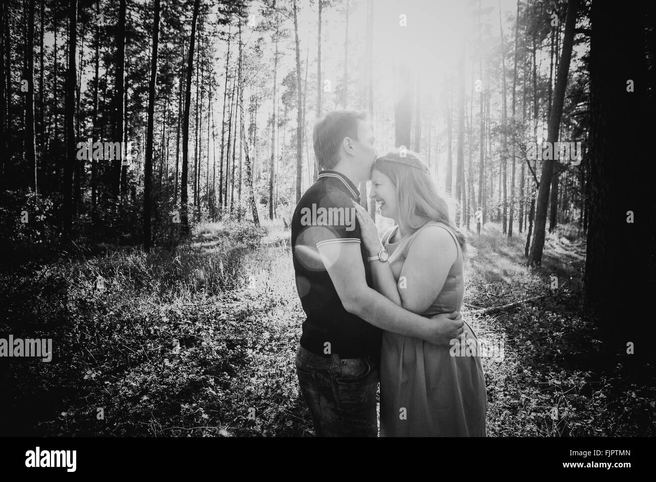 Black white photography romantic young couple kissing on background ...