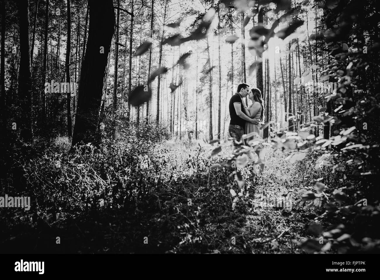 Black white photography romantic young couple kissing on background ...