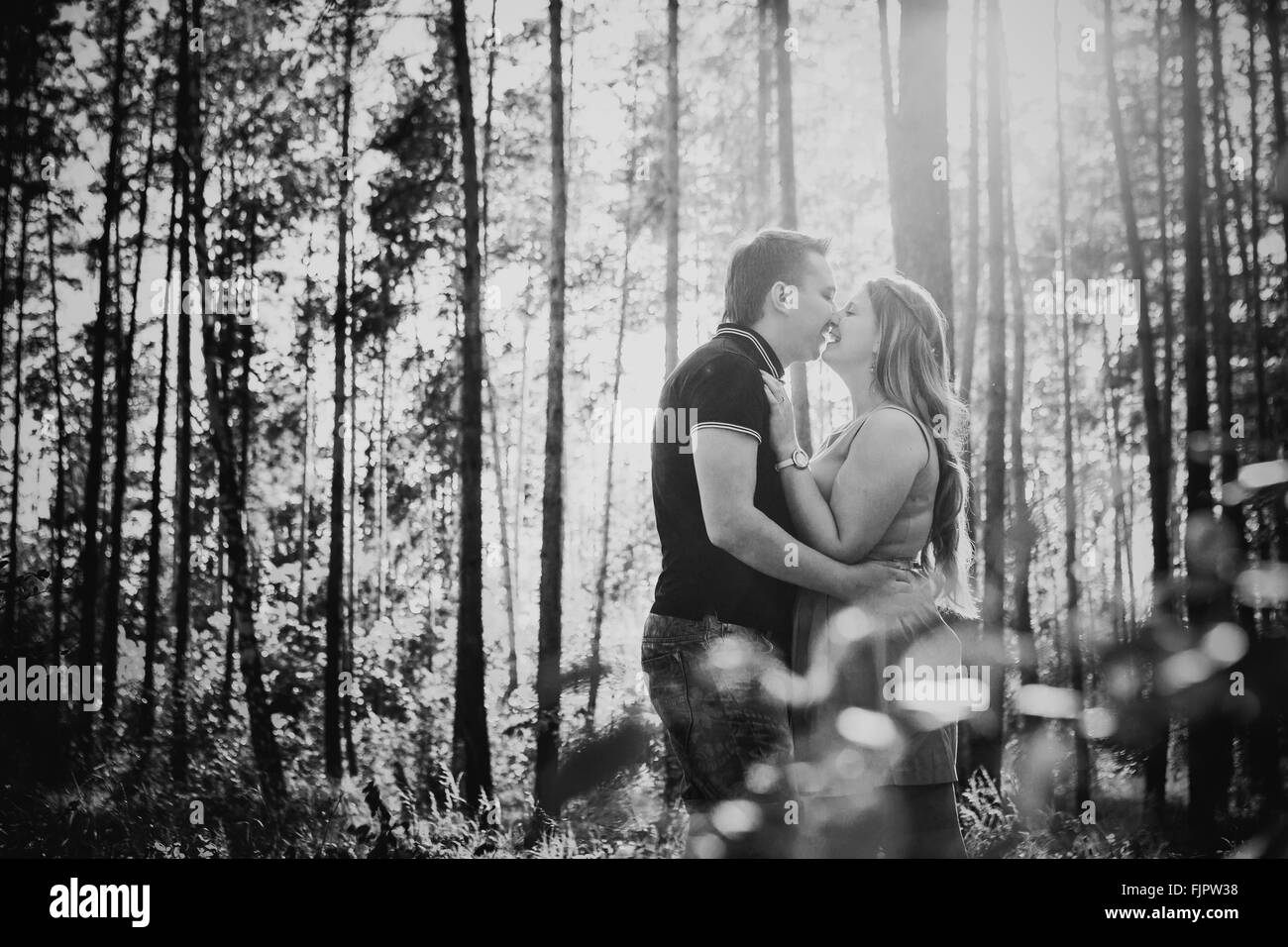 Black white photography romantic young couple kissing on background ...