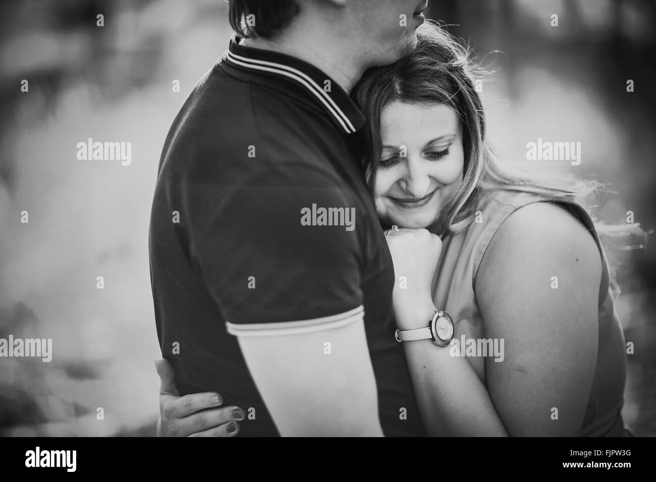 Black white photography romantic young couple kissing on background ...