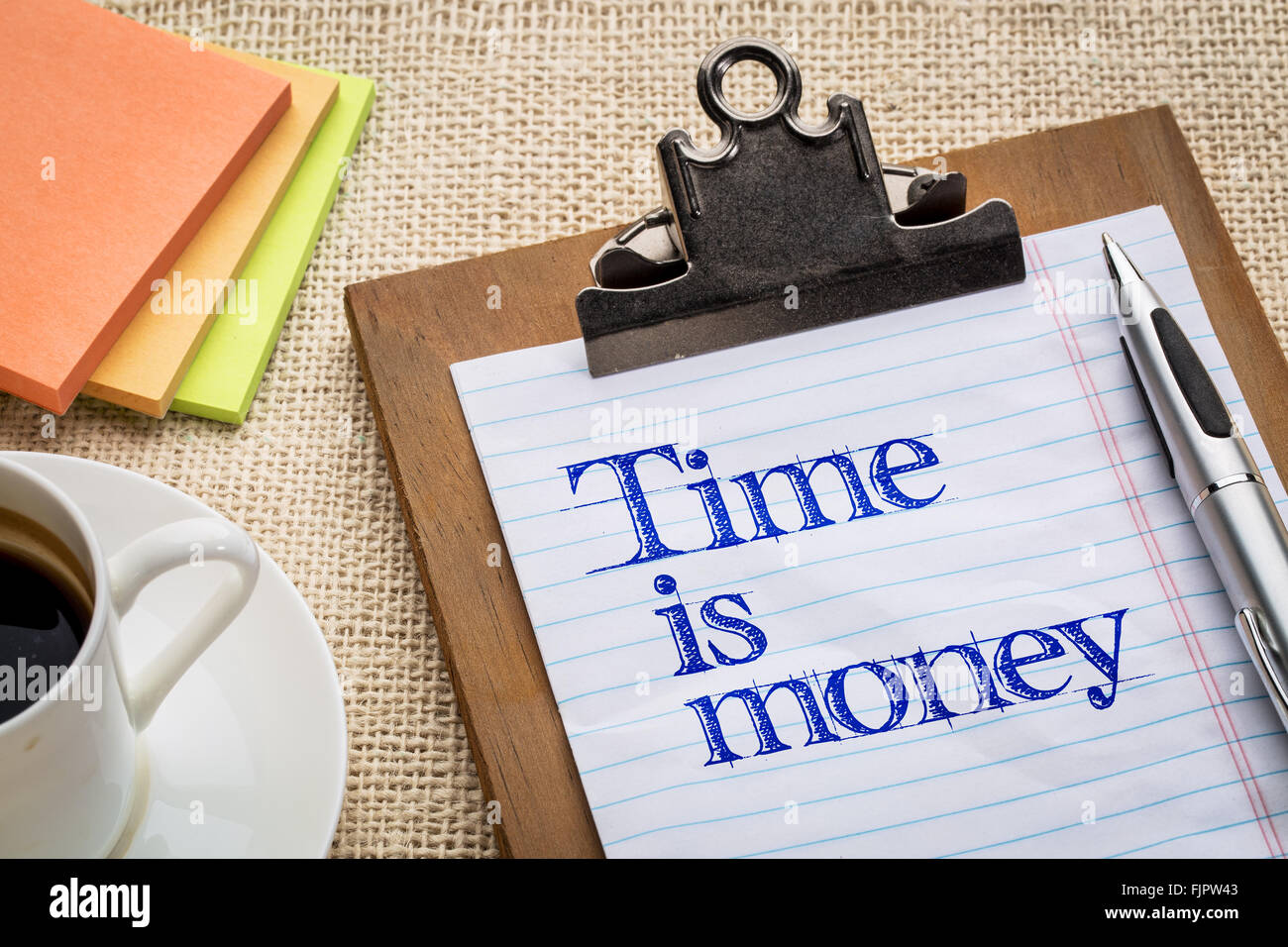 time is money reminder motivational slogan on a clipboard with a cup of coffee Stock Photo Alamy