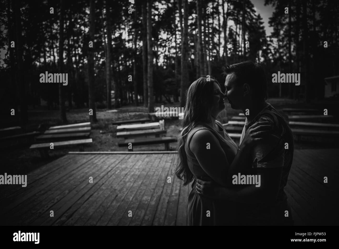 Black white photography romantic young couple kissing on background ...