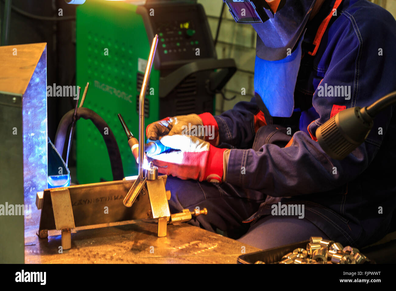 man welding iron factory Stock Photo