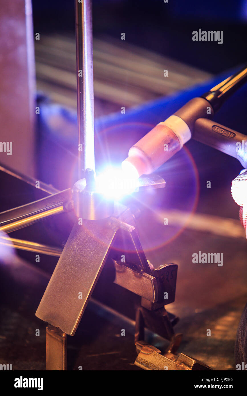 man welding iron factory Stock Photo Alamy