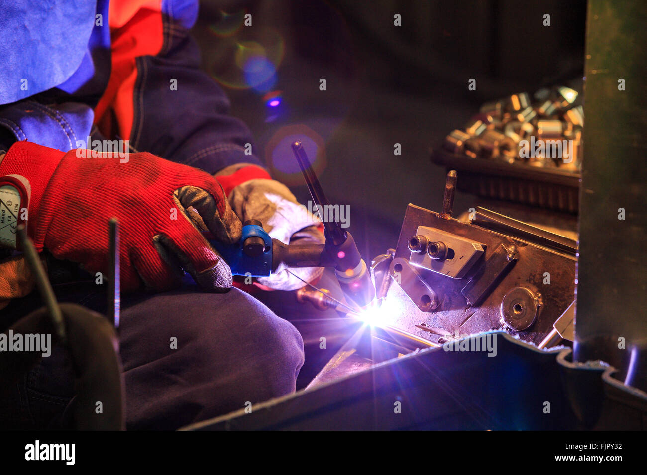 man welding iron factory Stock Photo