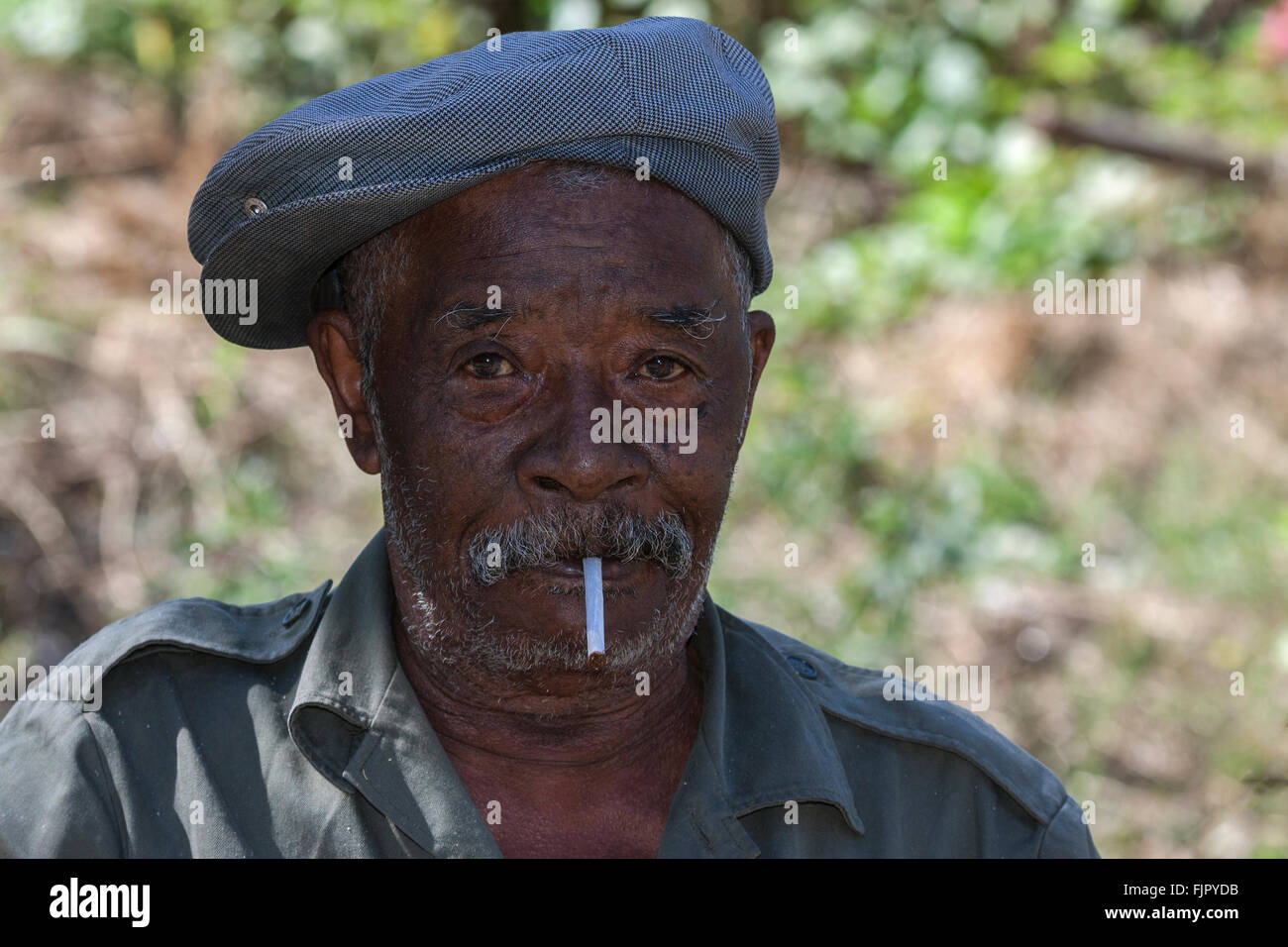 Local man with a cigarette and cap, portrait, Reunion Stock Photo