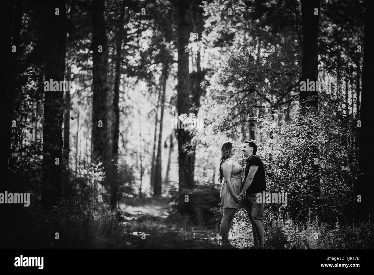 Black white photography romantic young couple kissing on background ...