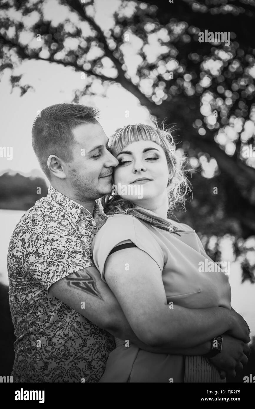 Black white photography romantic couple standing and kissing on ...