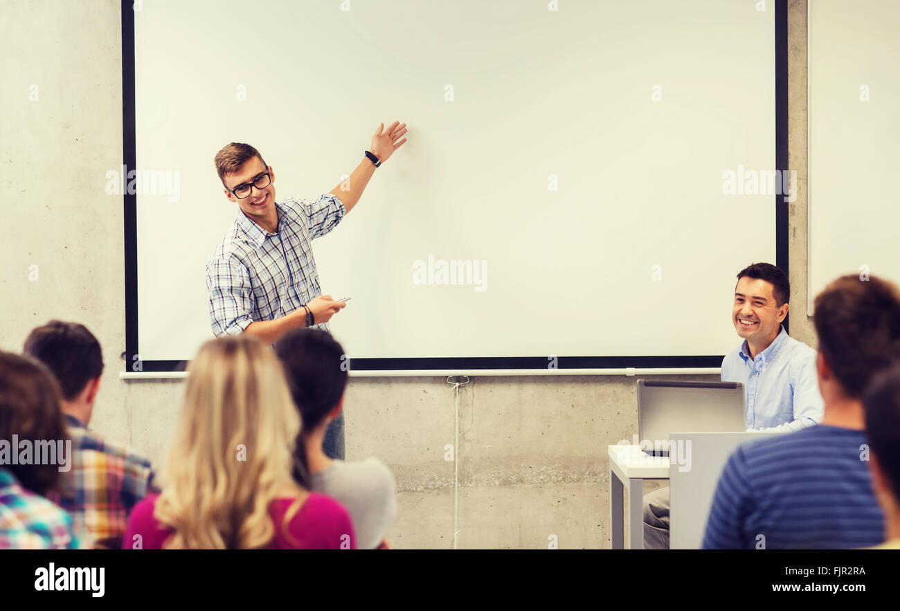 group of students and teacher in classroom Stock Photo - Alamy