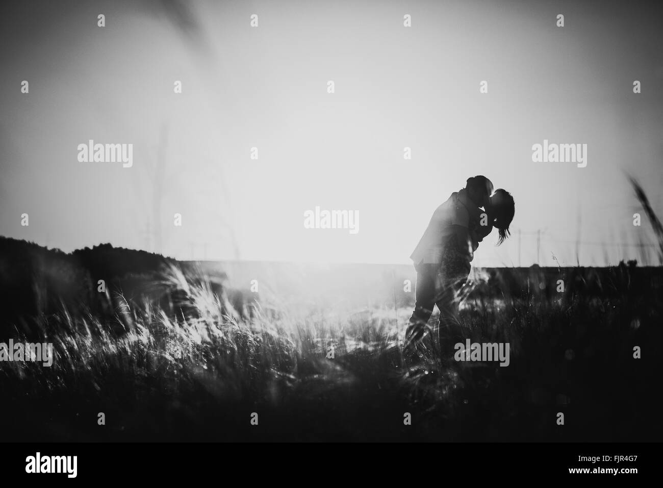 Black white photography romantic couple standing and kissing on ...